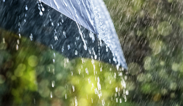 Heavy rain on umbrella