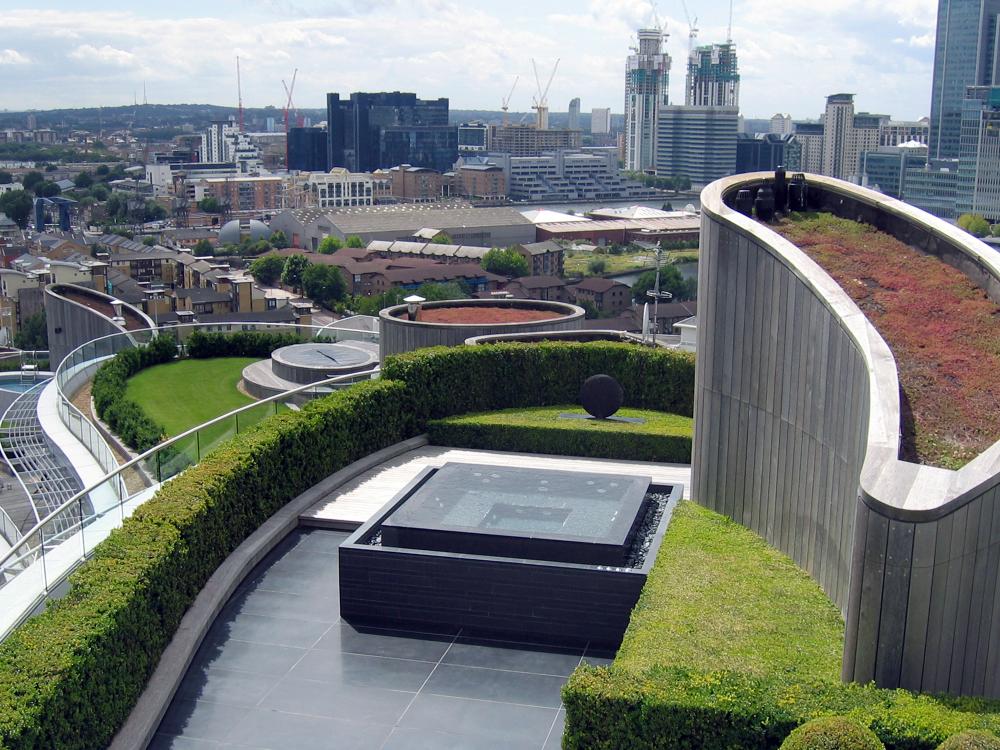 Roof terrace with modern fountain and Sedum roof