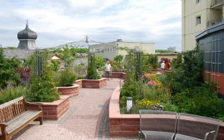 People sitting on benches on roof garden