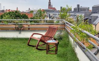 Roof garden with lawn and rocking chair